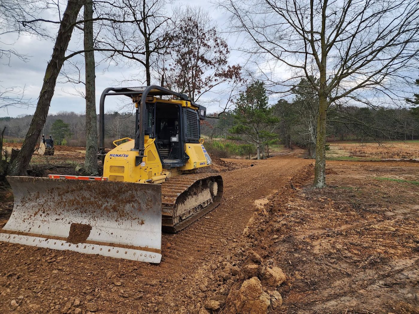 Dozer cutting in a new gravel road on rural property