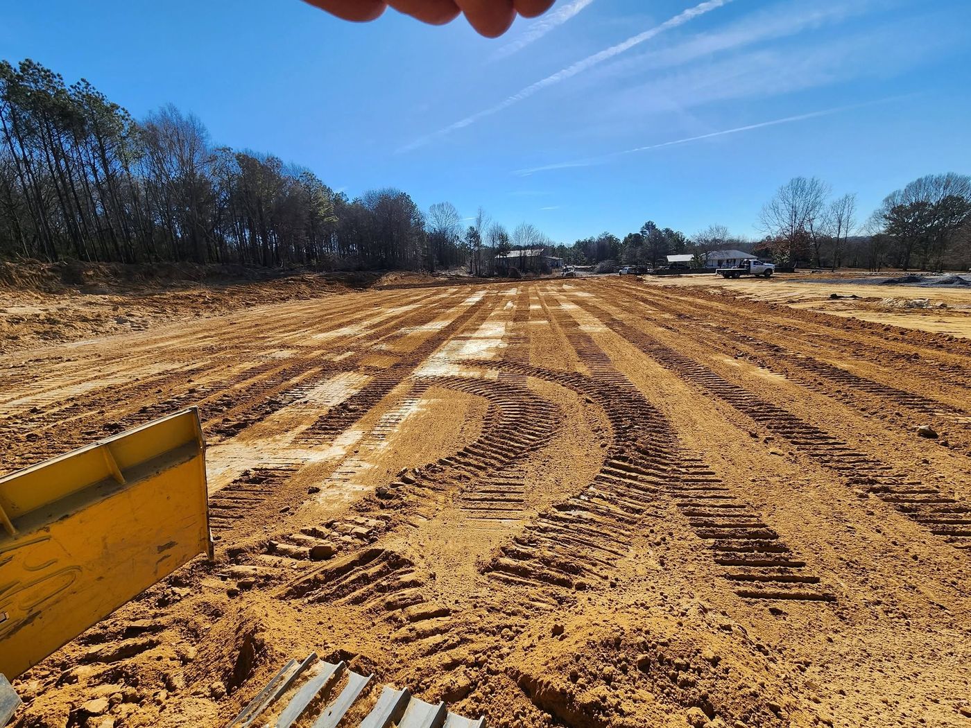 Wide graded pad with dozer tracks
